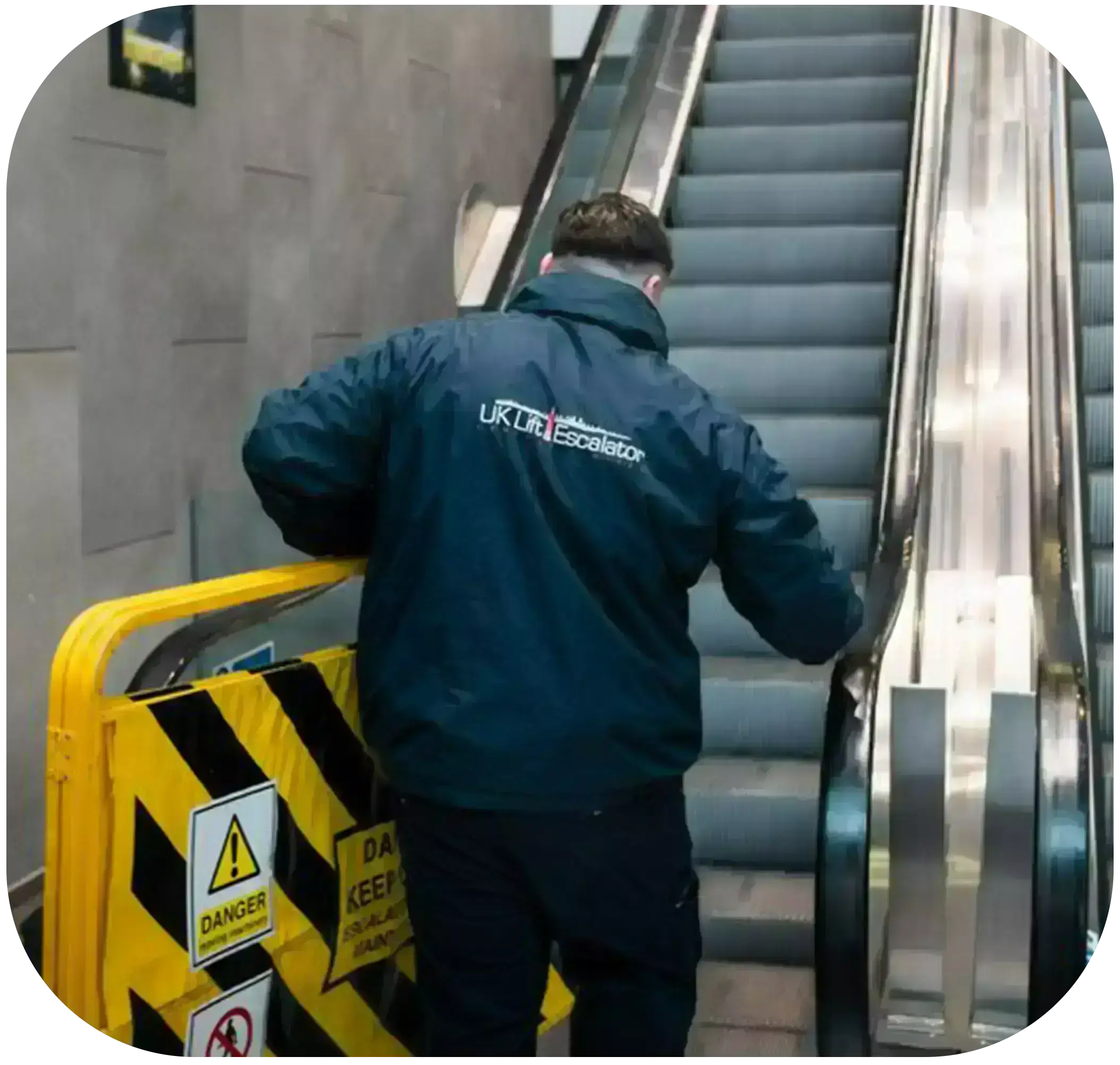 technician checking the lift & Escalator while walking