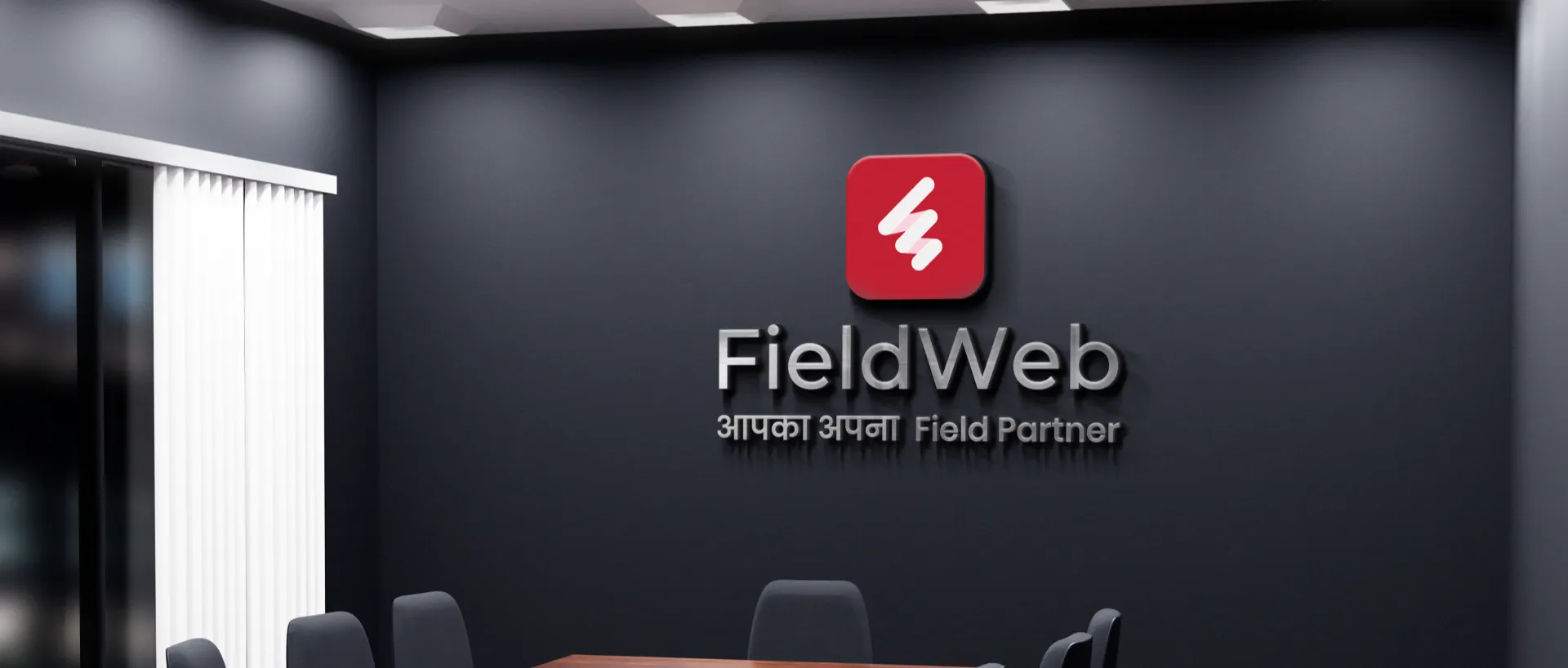 showing fieldweb logo with tagline on grey wall