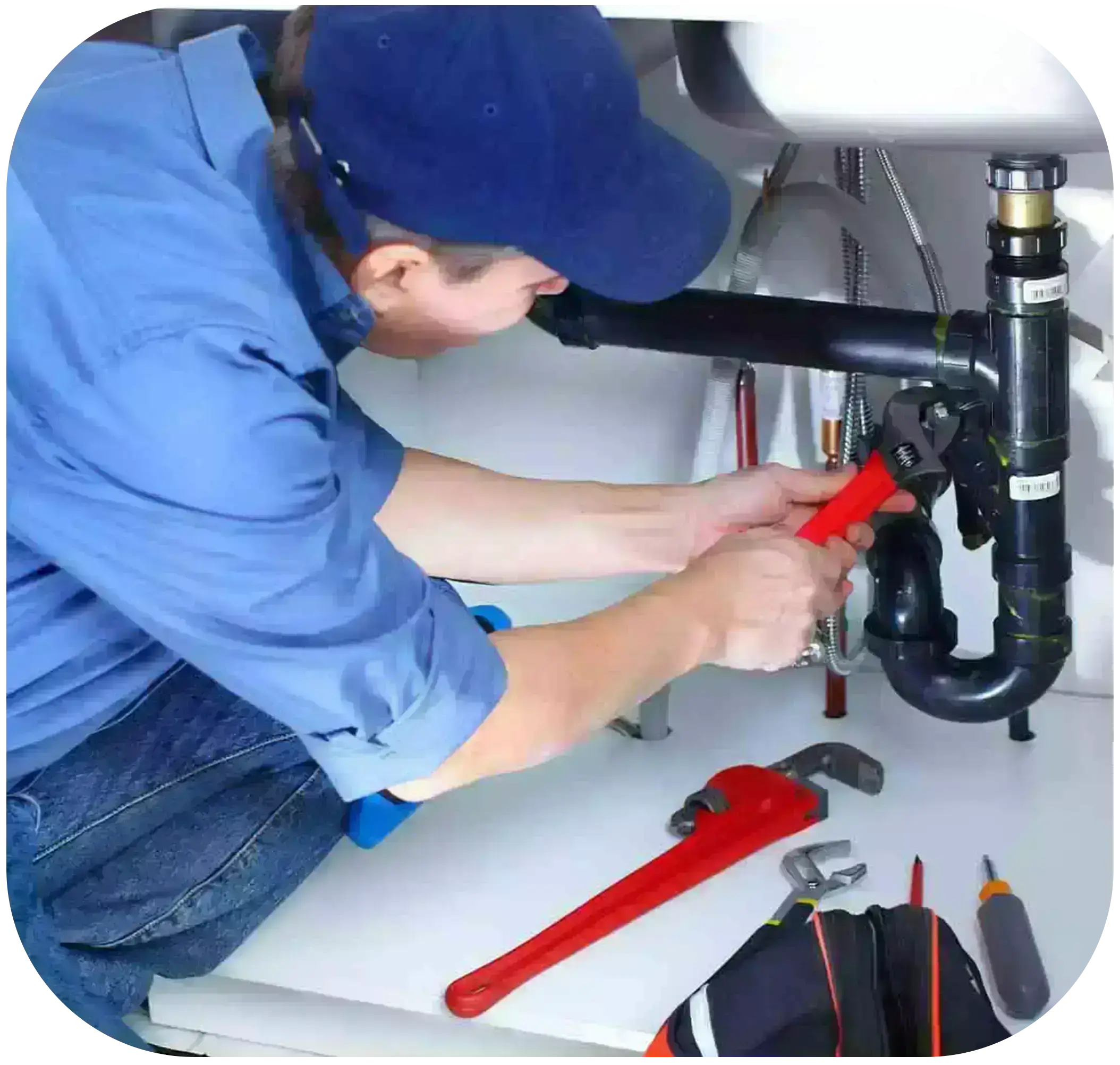 technician repairing the water pipe with pliers